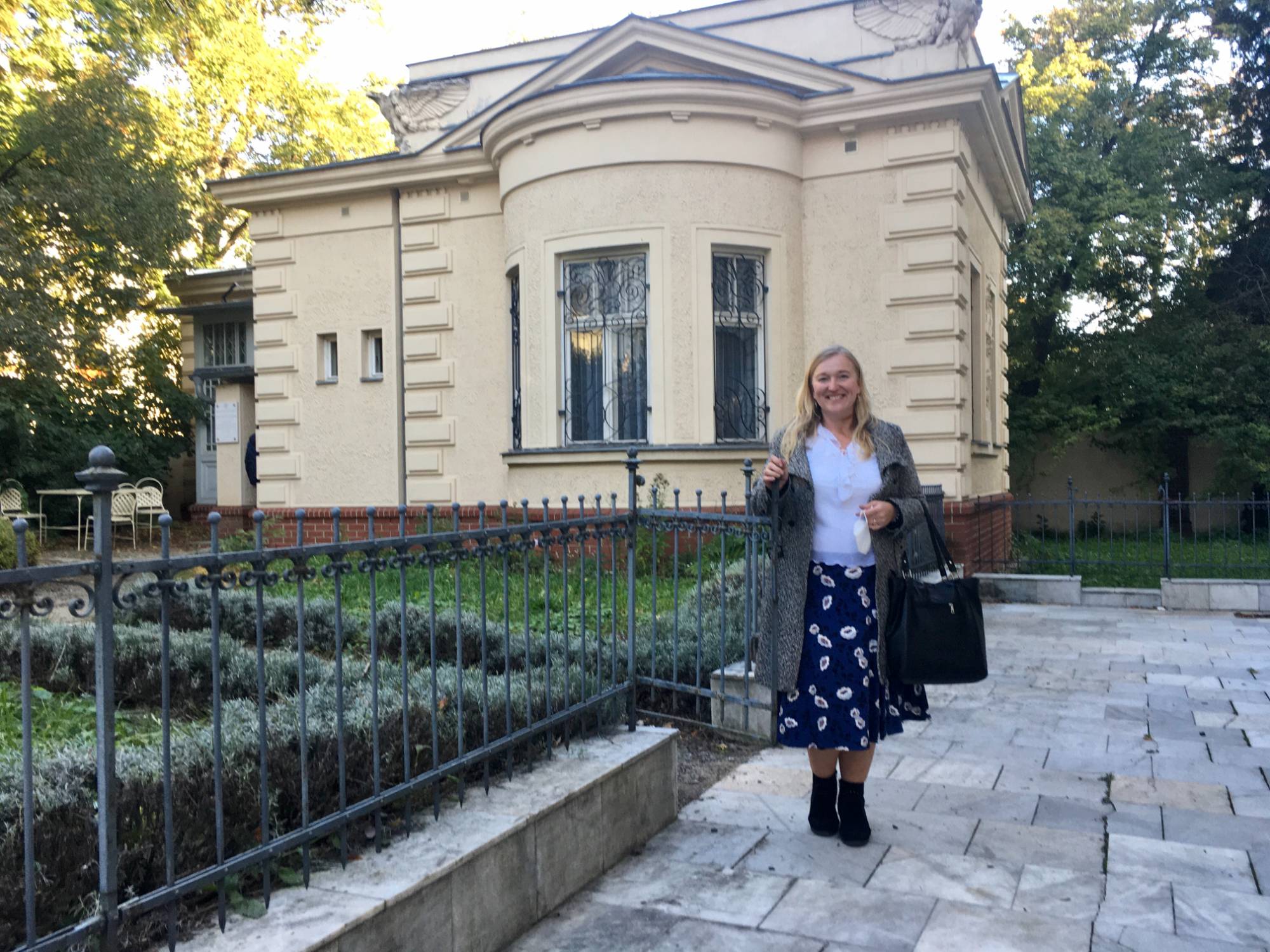 A photo of Leos Janacek's House with Marlen Vavrikova standing in front of it.